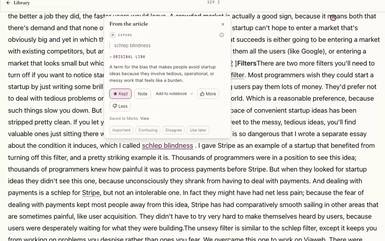 The Omphalis reader with “schlep blindness” underlined in the text and a card beside it explaining the term